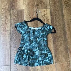 A camouflage smocked Justice top